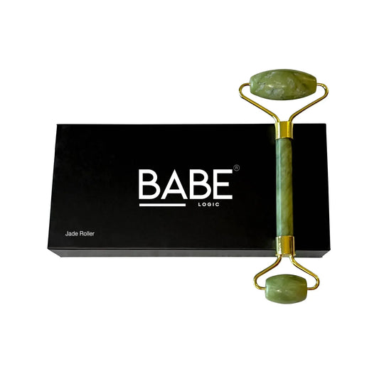 Jade roller with dual rollers on black Babe Logic packaging, promotes skincare benefits.