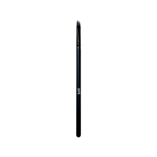 Angled liner brush with thin, firm bristles for precision in eye and brow application.