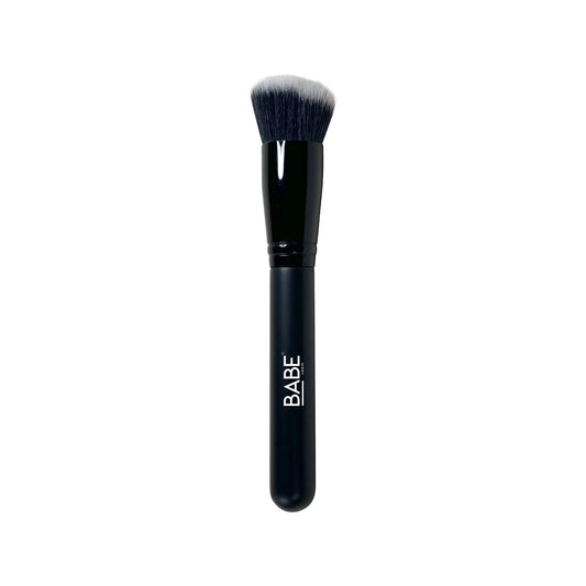 Stipple & Blend Foundation Brush with angled, densely packed synthetic bristles for streak-free application.