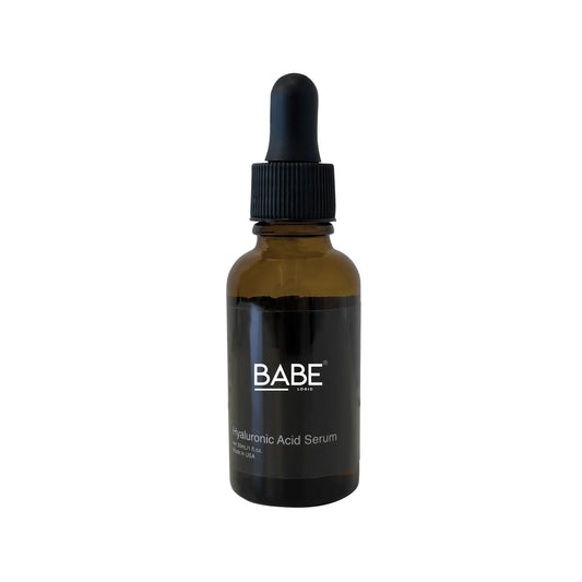 Brown bottle of Hyaluronic Acid Serum with a black dropper cap.