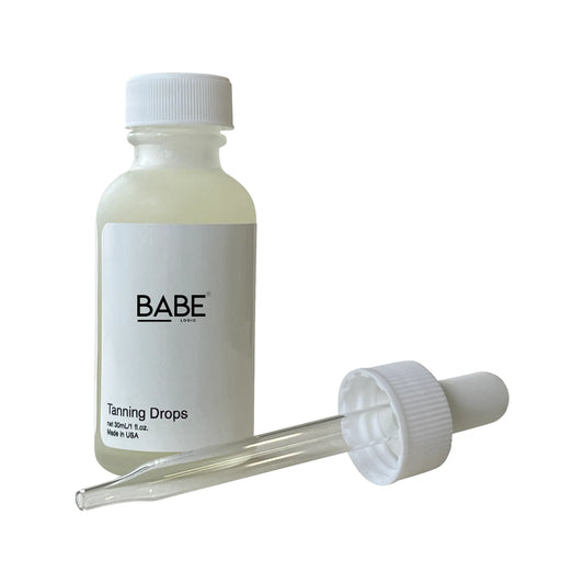 Tanning Drops bottle with dropper, vegan formula for natural glow.