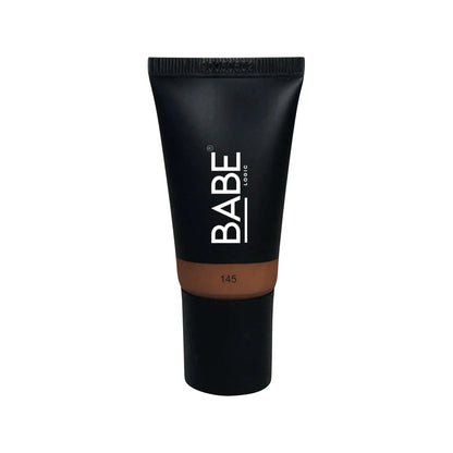 Black tube of tinted moisturizer by Babe, offering sheer coverage and essential hydration for all skin types.