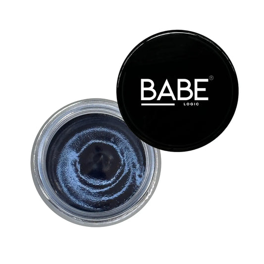 Top view of a jar displaying the deep-cleansing Glow Mask with a thermal charcoal formula for radiant skin.