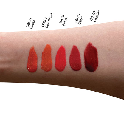 Swatches of liquid blush shades on arm, showcasing diverse, vibrant tones.