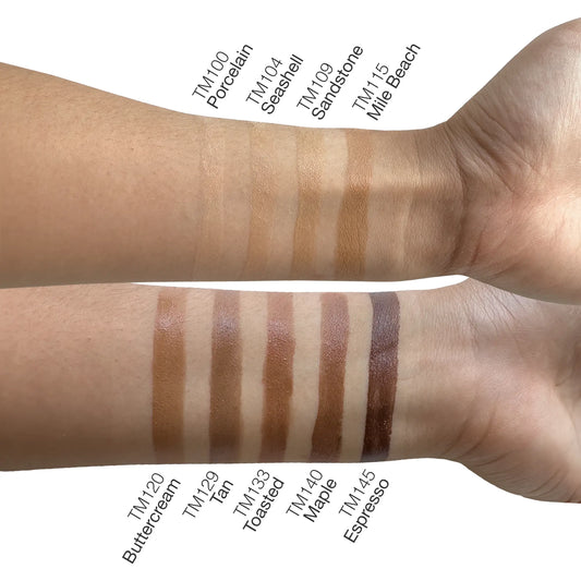 Swatches of various shades of tinted moisturizer on different skin tones, illustrating color options and coverage.