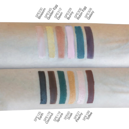 Assorted swatches of talc-free single pan eyeshadow shades on arm.